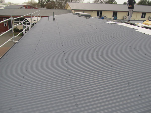 Roofing work on suburban home